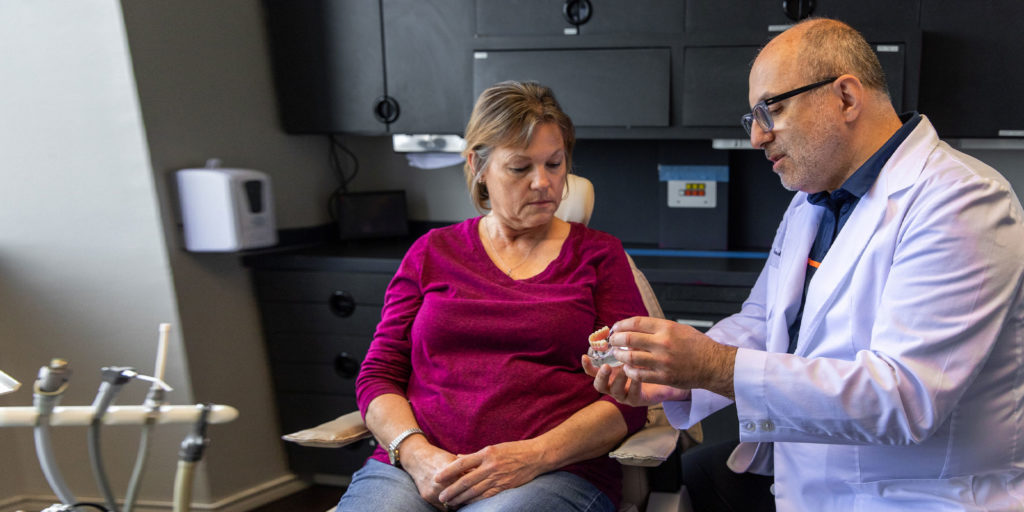 Dr. Boltchi with a patient for a consultation